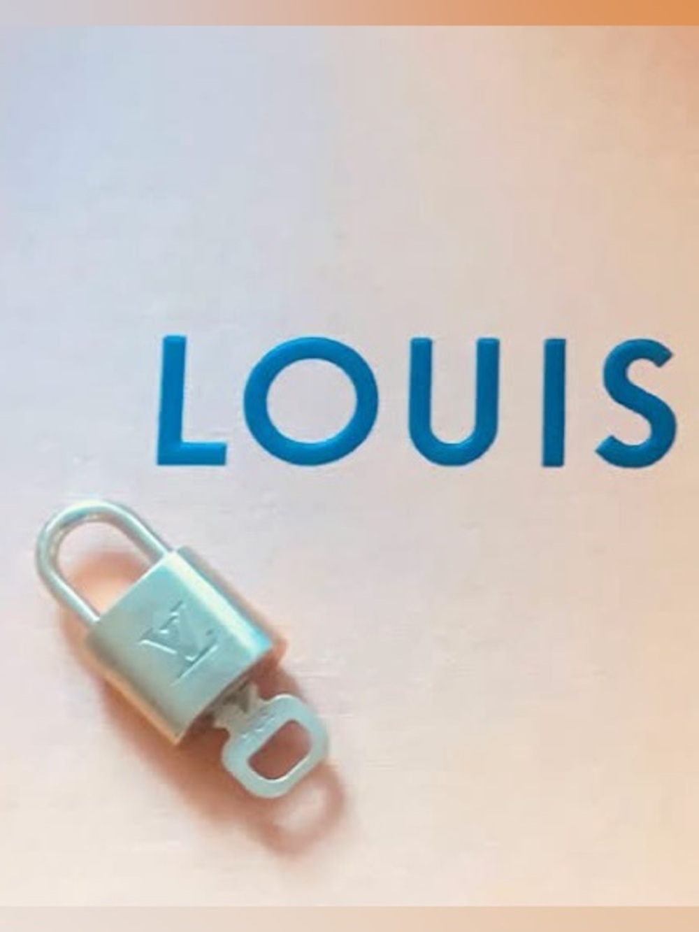 Authentic Louis Vuitton solid brass gold-tone padlock with key. #233